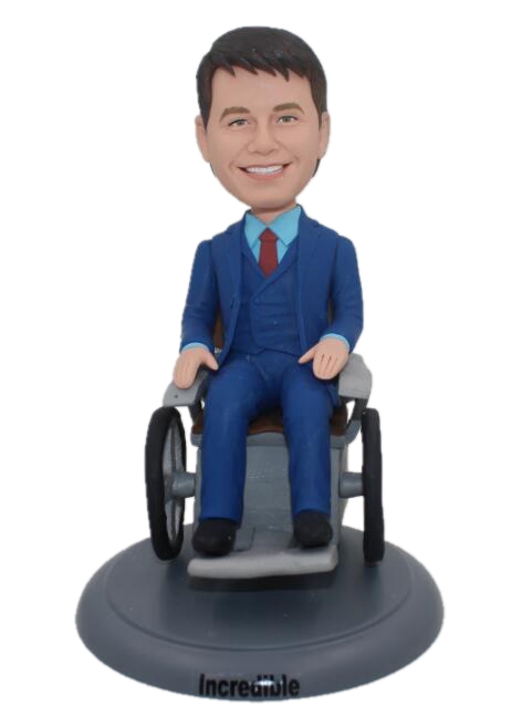 Personalized cake toppers sitting on wheelchairs